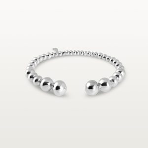 img src="bracelet.jpg" alt="bracelet jonc ouvert en or blanc avec perles sphériques design minimaliste"