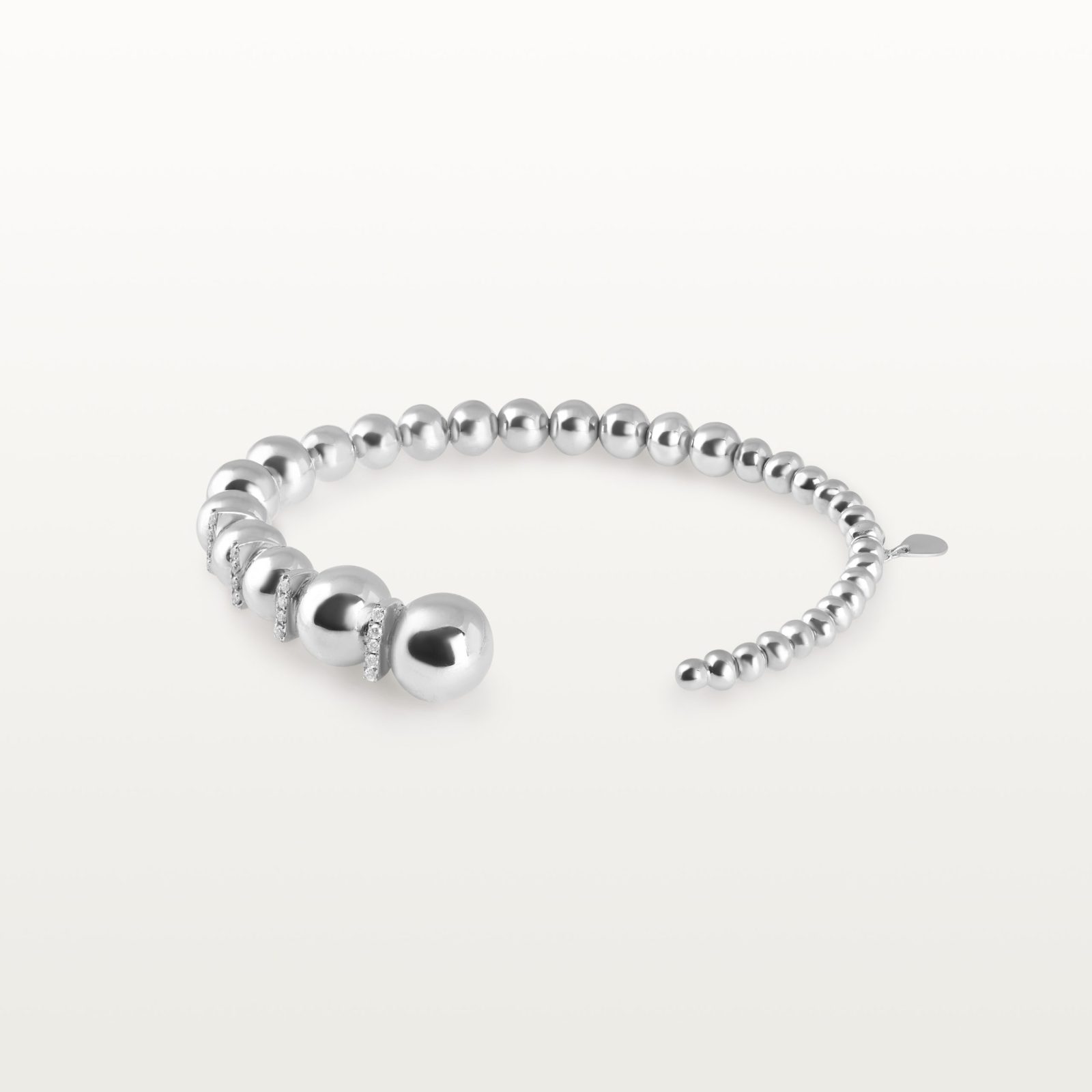 img src="bracelet.jpg" alt="bracelet jonc ouvert en or blanc avec boules sphériques polies design minimaliste"