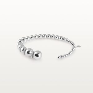 img src="bracelet.jpg" alt="bracelet jonc ouvert en or blanc avec boules sphériques polies design minimaliste"